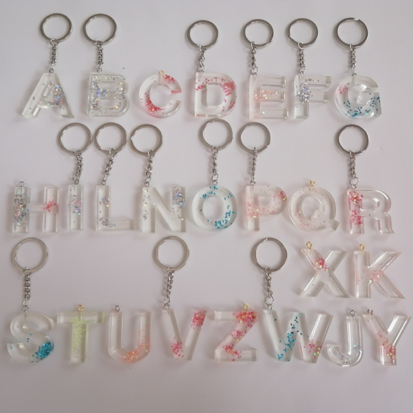 Iniziale in resina trasparente glitter